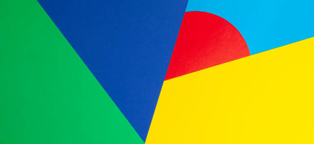 istock Abstract geometric shape yelllow, blue, red, green color paper background 1202673331