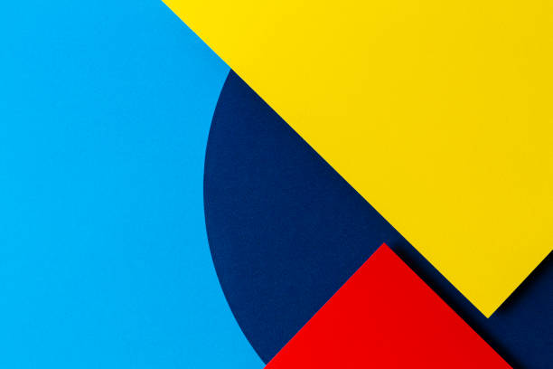istock Abstract colored paper texture background. Minimal geometric shapes and lines in light blue, navy, red and yellow colours 1202673570