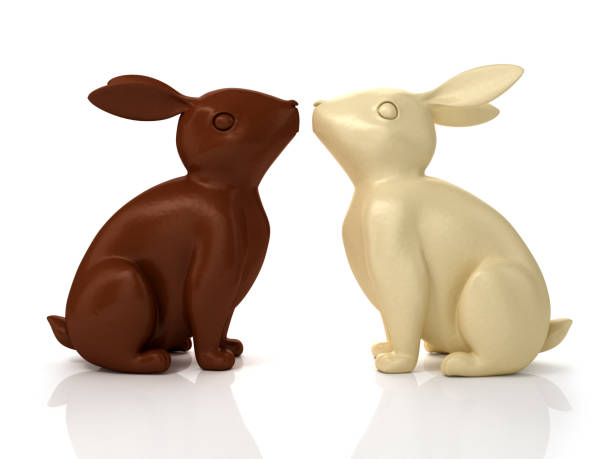 istock 3D illustration of dark and white chocolate rabbits 1202673803