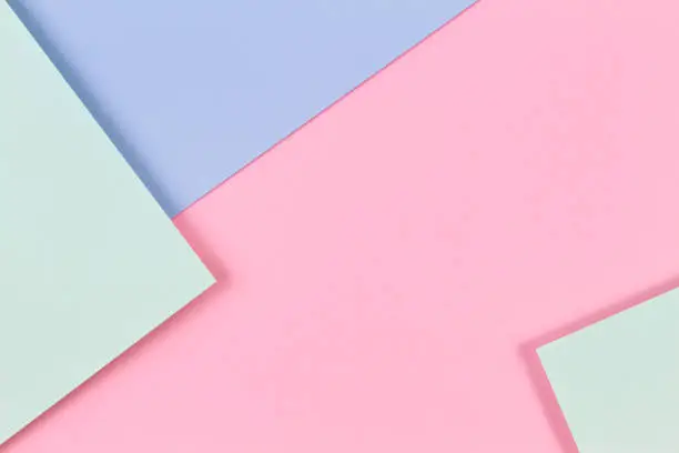 Photo of Abstract colored paper texture background. Minimal geometric shapes and lines in pastel pink, light blue and green colours