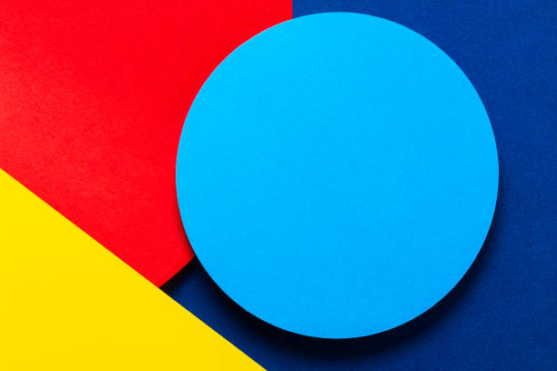 istock Abstract colored paper texture background. Minimal geometric shapes and lines in light blue, navy, red and yellow colors 1202674522