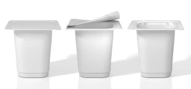 Photo of Three plastic cups for yoghurt with foil lid. 3D Illustration.