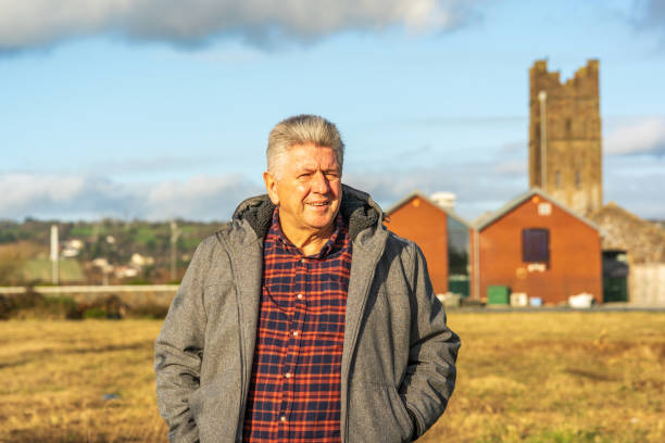 istock Senior man standing on wasteland 1202678927