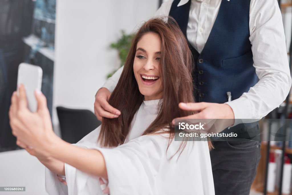 Beautiful Woman With Mobile Phone Making Selfie In Hair Salon Stock Photo - Download Image Now - iStock Beautiful Woman With Mobile Phone Making Selfie In Hair Salon Stock Photo - Download Image Now - iStock