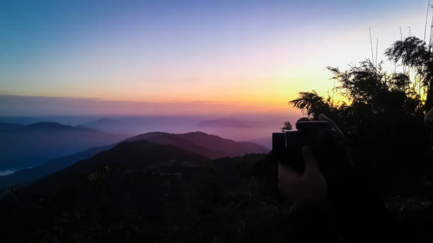 this is Kanchenjunga Mountain in Darjeeling, West Bengal, India in morning golden yellow top time the photo clicked from Tiger hill
