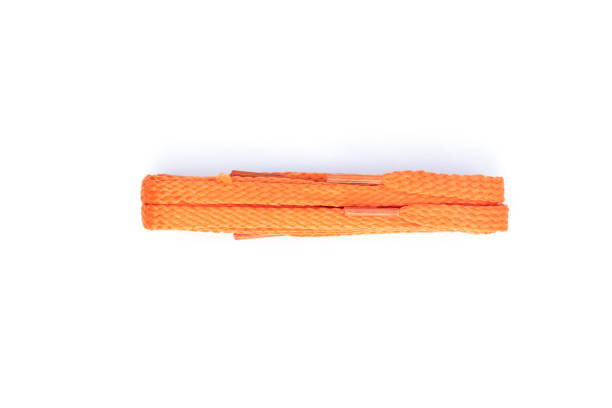 istock Orange  shoelaces on a white background 1202683081