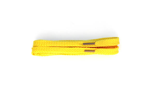 istock yellow shoelaces on a white background 1202683126
