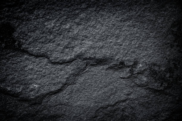 istock Dark gray granite or black slate  stone texture abstract for nature background 1202683432