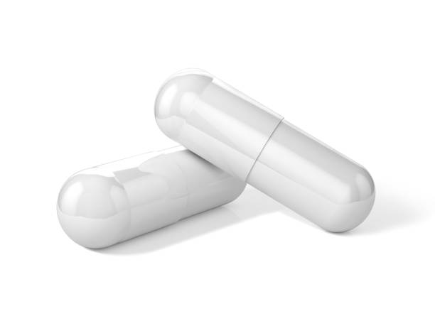 istock 3D Illustration of two white capsule pills 1202684861