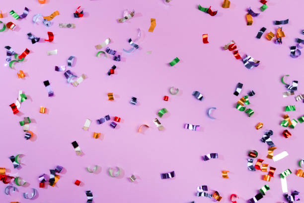 istock Colour sparkles on violet holiday background. Festive backdrop for your projects. 1202686509