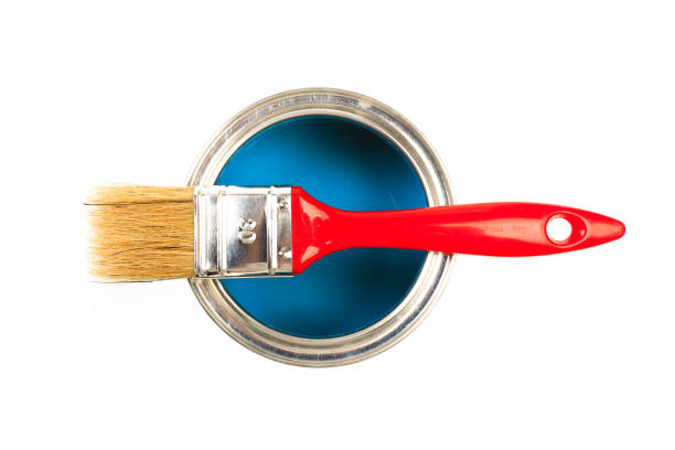 istock Can with blue  paint and brush isolated on white background top view - Image 1202686640