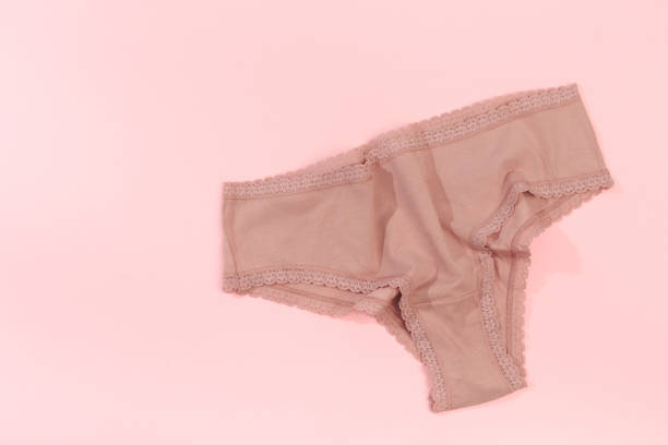 istock Female panties over pink  background 1202686661