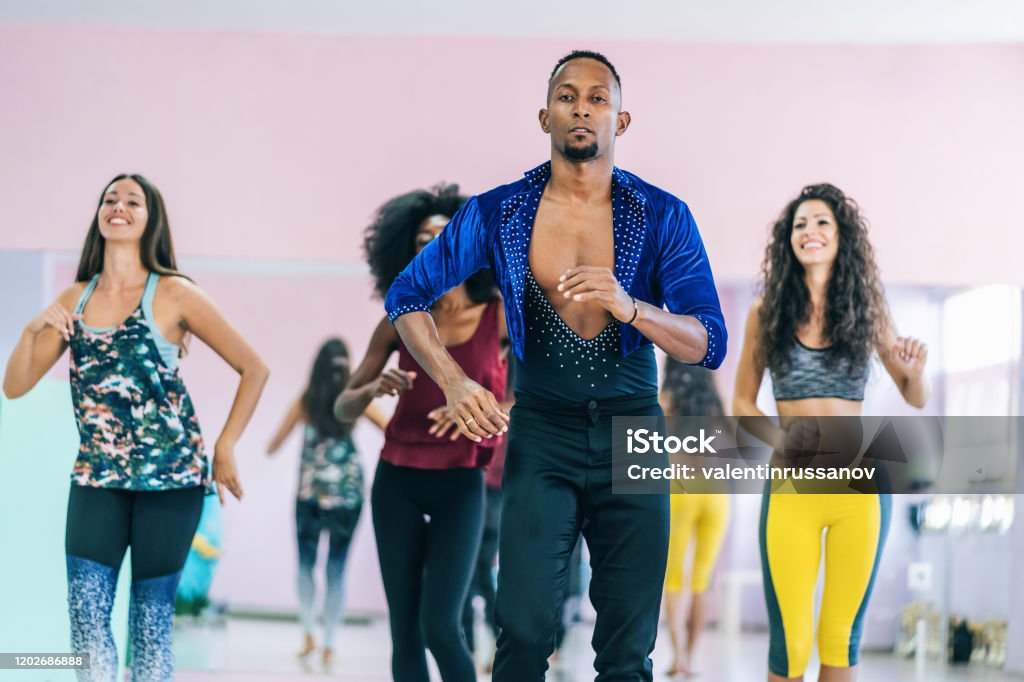 Brazilian male teacher and students practicing in studio 20-29 Years Stock Photo