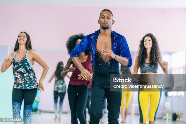 Brazilian Male Teacher And Students Practicing In Studio Stock Photo - Download Image Now