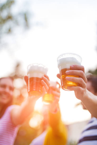 istock Friends enjoying drinking beer in the backyard. 1202688226