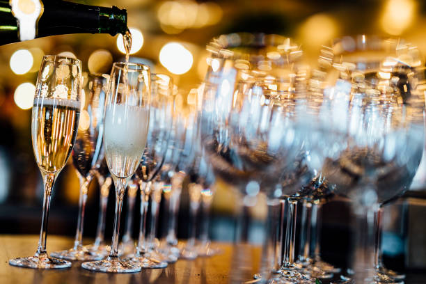 istock Man is pouring red or white wine 1202690967