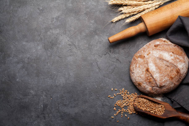 istock Bread with wheat, flour and cooking utensils 1202691162