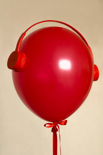 istock red balloon with oldschool headphones 1202691473