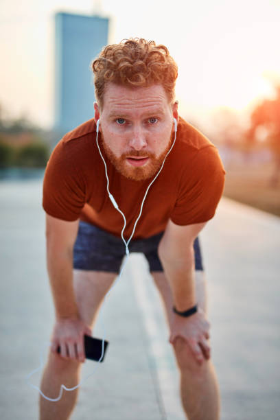 istock Modern young man working out in an urban park. 1202691713