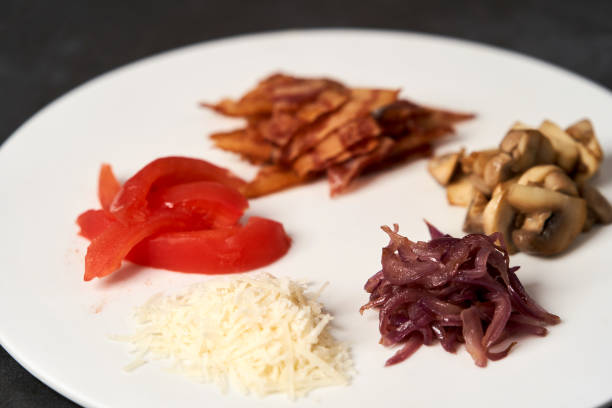 istock Traditional breakfast omelette with bacon, tomatoes, mushrooms, onion 1202691801