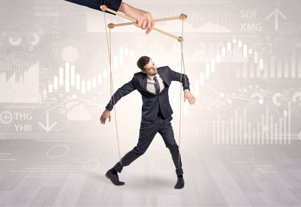 istock Puppet businessman with financial concept 1202691920