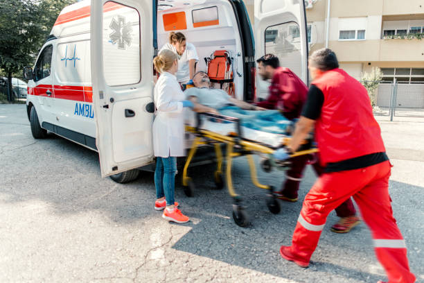 istock Paramedic team pushing stretcher 1202691959