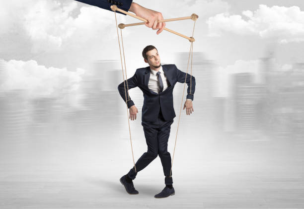 istock Puppet man with big city concept 1202692101