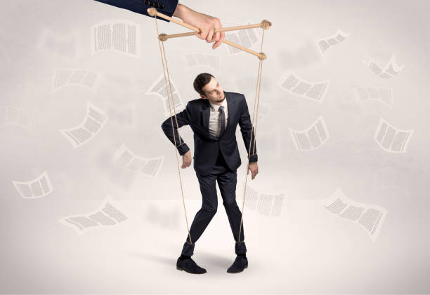 istock Puppet employee with documents and staffs around 1202692195