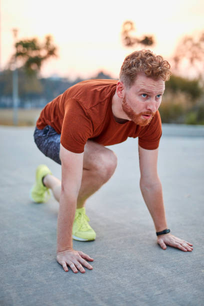 istock Young modern man jogging / exercising in an urban park. 1202693756