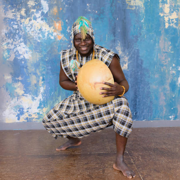 istock Handsome African man with traditional clothes and musical instruments 1202693938