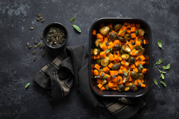 istock Brussels sprouts baked with butternut squash, top view 1202694016