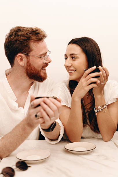 istock Loving couple in a coffee shop 1202694653