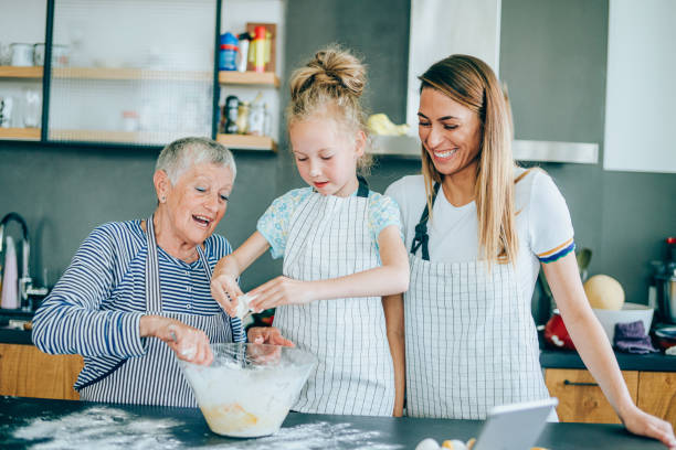 istock Making cookies with mom and grandma is so much fun 1202694764