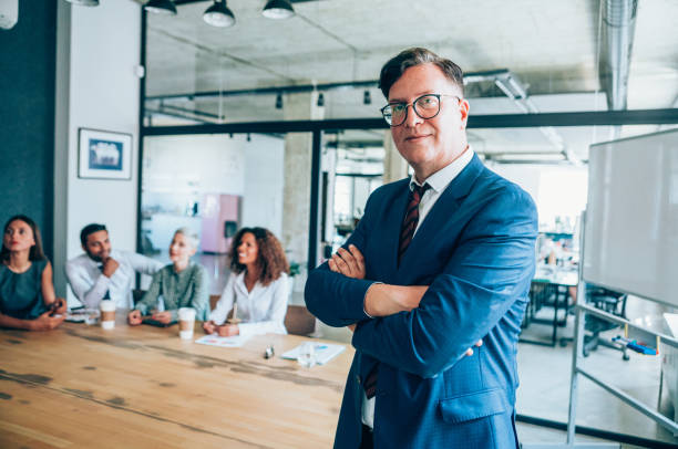 istock Businessman and his team. 1202694805