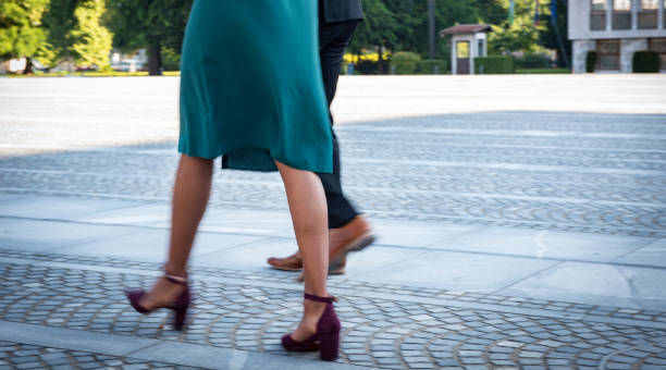 istock Business people walk along promenade 1202695567