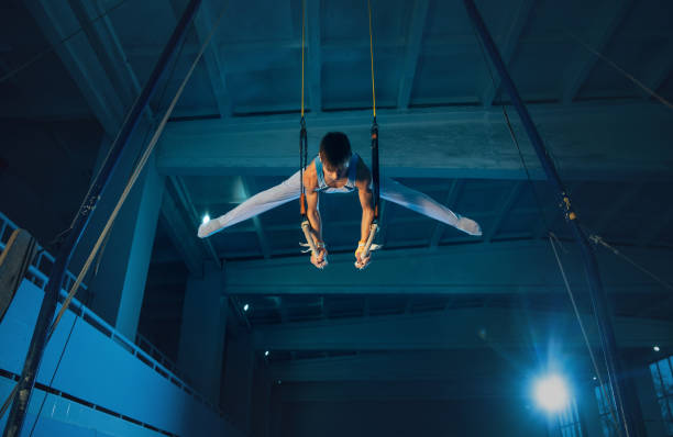 istock Little male gymnast training in gym, flexible and active 1202696478