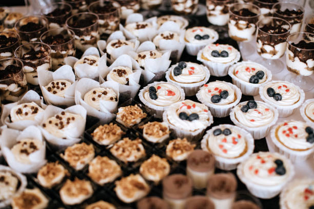 istock Beautiful Candy bar at wedding ceremony with desserts, cakes 1202697703