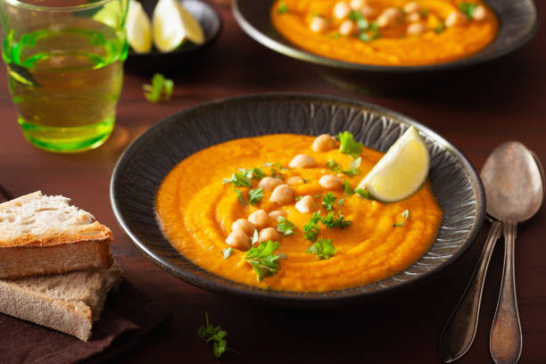 istock creamy carrot chickpea soup on dark rustic background 1202698191