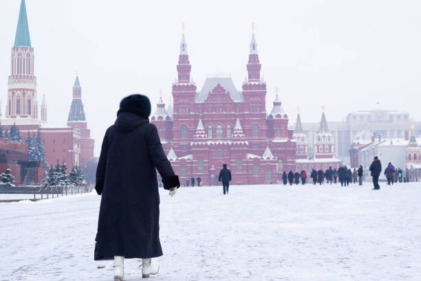 Lady dresses in fur walking on the Red Square, Moscow in the wintertime.