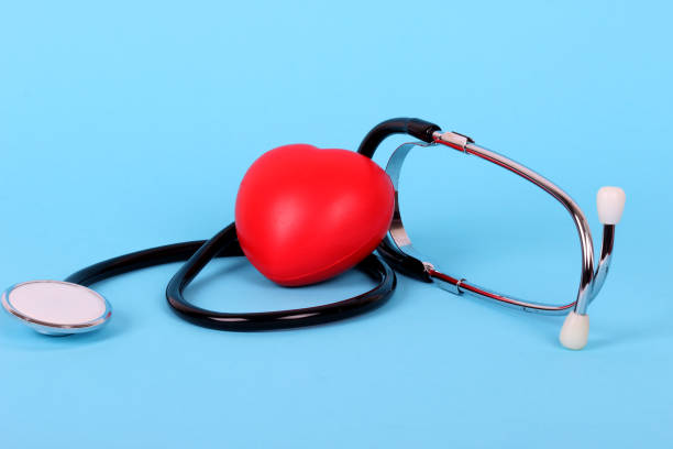 istock stethoscope and heart isolated on blue background 1202698311