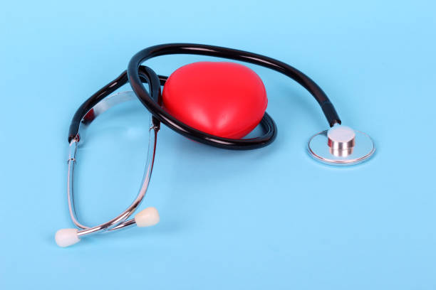 istock stethoscope and heart isolated on blue background 1202698332