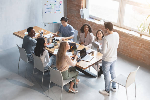 istock Young manager speeking at morning briefing in office 1202698439