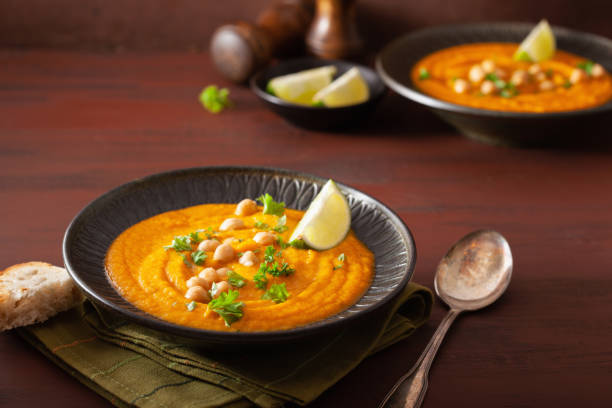 istock creamy carrot chickpea soup on dark rustic background 1202698474