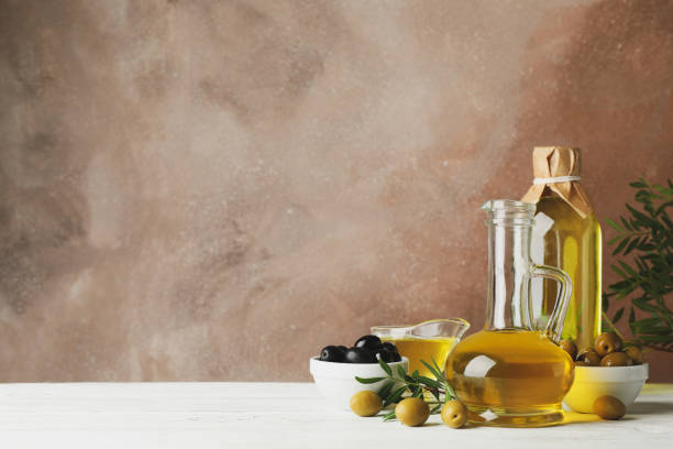 istock Composition with olive oil and olives against brown background, space for text 1202699425