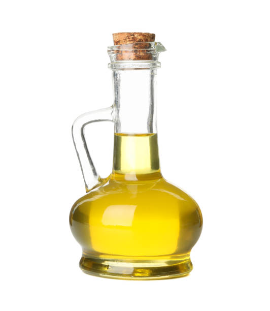 istock Jug with olive oil isolated on white background 1202700479
