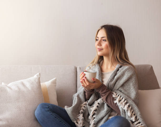 istock Peaceful girl enjoying hot coffee at home, empty space 1202700793