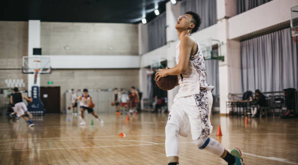 istock A young Chinese man shooting at the basket 1202702511
