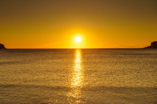 istock Sunset or sunrise over sea surface 1202702589