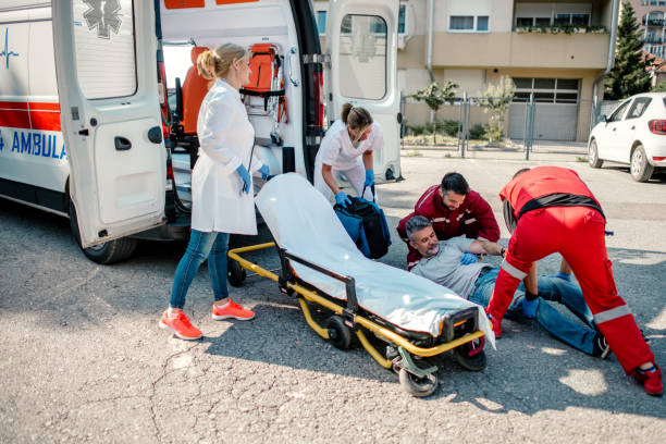 istock Paramedic Team Helping Injured man 1202702720