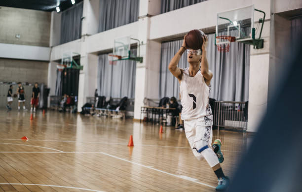 istock A young Chinese man shooting at the basket 1202702737